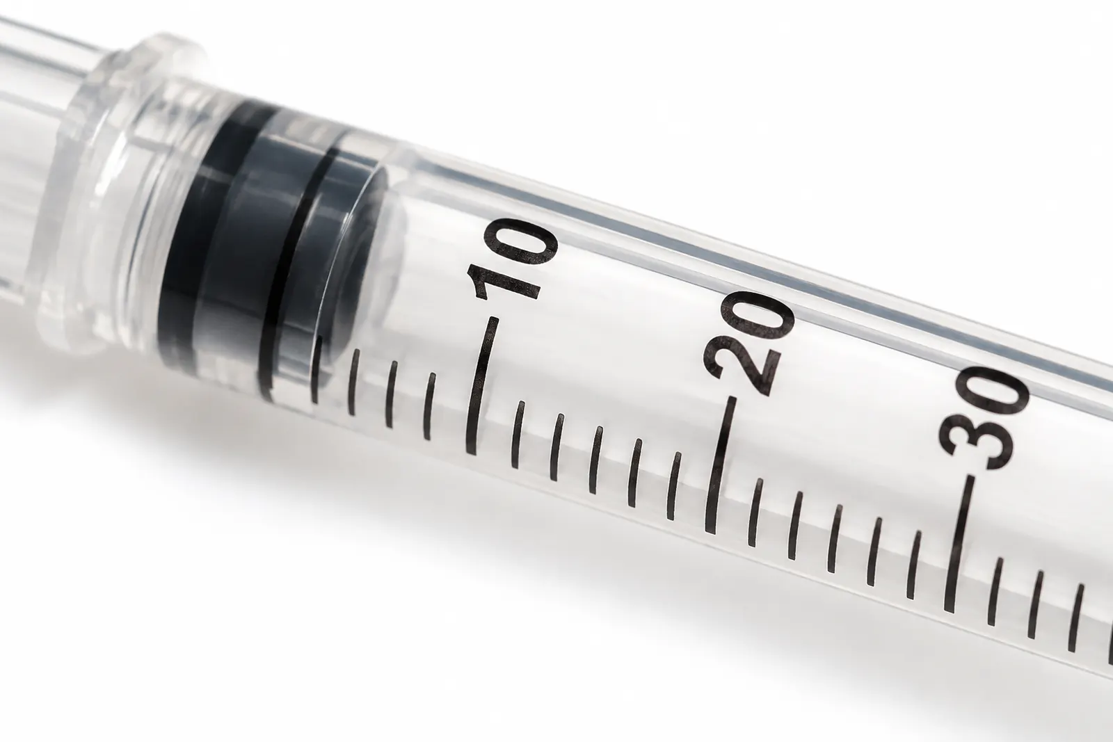 Close-up of U-100 insulin syringe markings at 10, 20 and 30 units